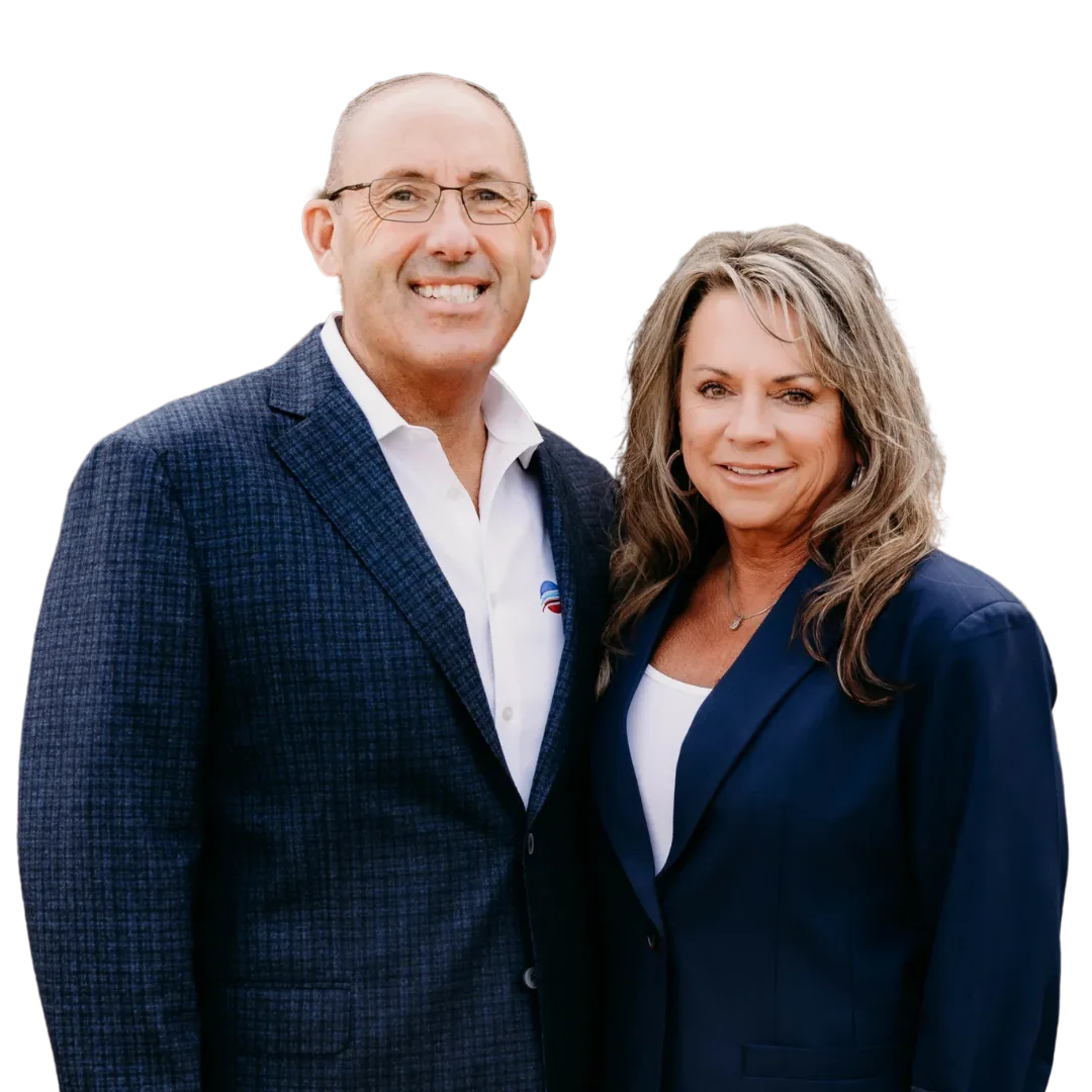 Mike and Trina Petitt dressed in Logo collar shirts and he has on a logo hat.